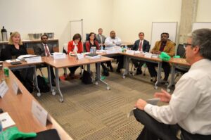 a group of people sitting at a table in a room